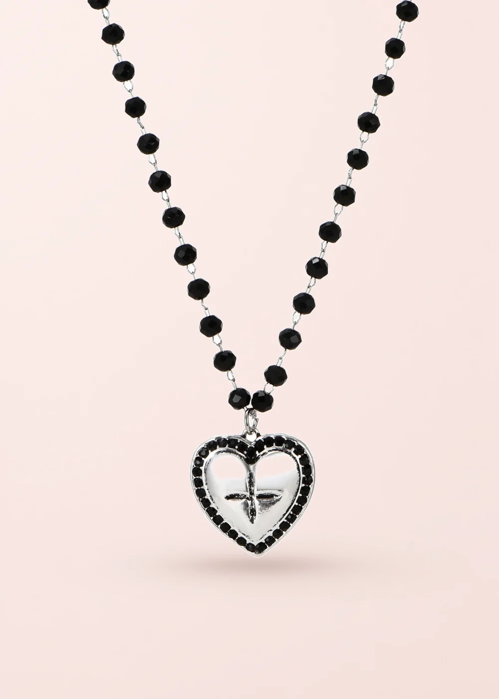 Aoi Y2k Black Silver Necklace on a pink background