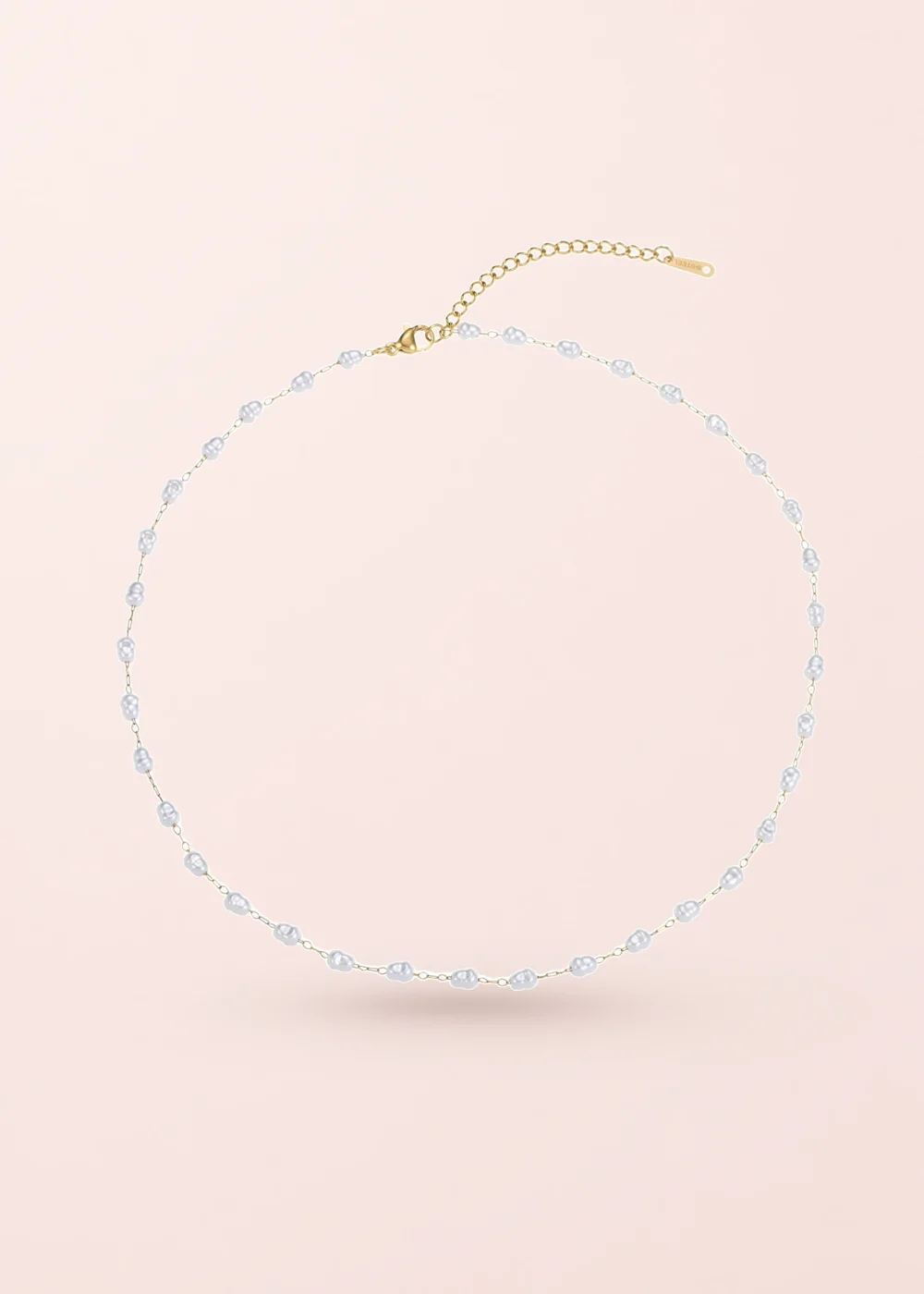 Lynn Little Pearls Necklace on a pink background