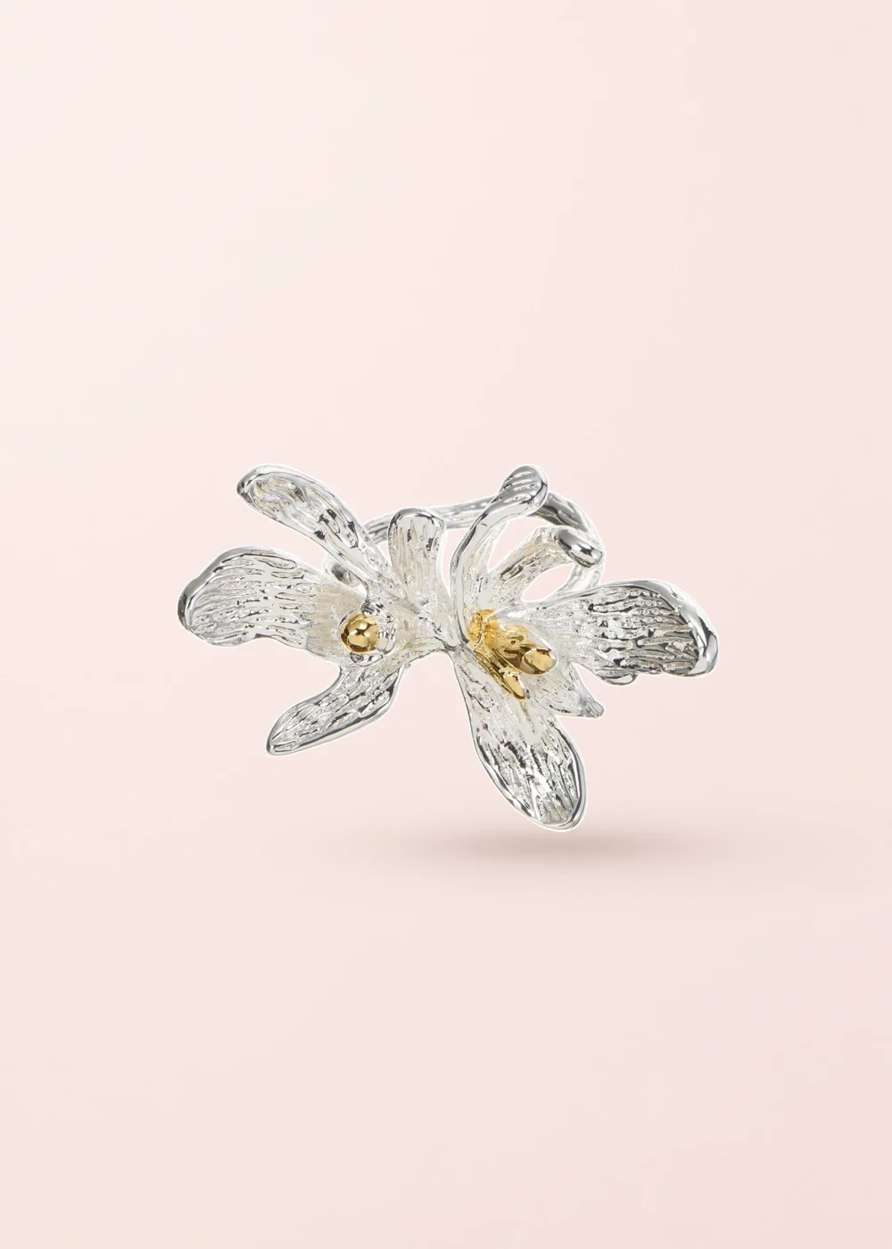 Sandra Wild Flower Silver Golden Ring on a pink background