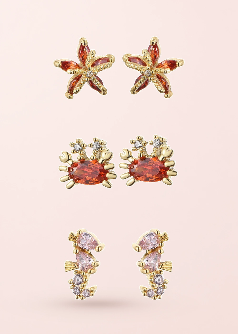 (Combo 3-in-1) Petit Crystal Sea Friends Earrings Set on a pink background