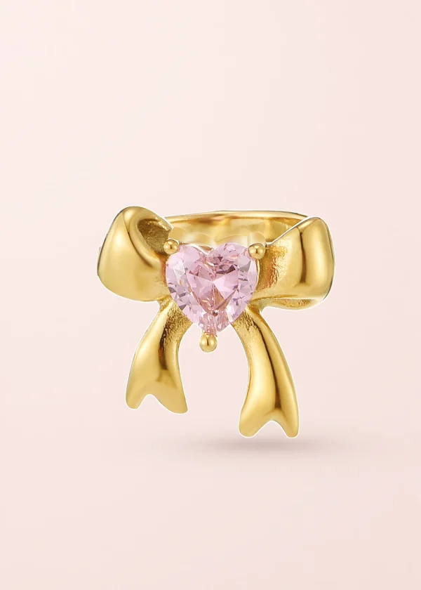 Jinn Bow Pink – Ring mit Schleife und Herz in Goldoptik