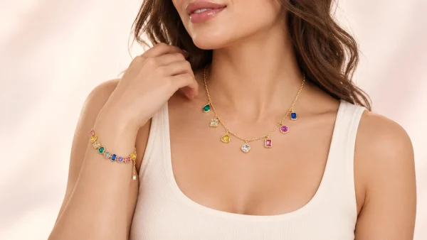 An adult model wearing a Dalia necklace and Rania bracelet